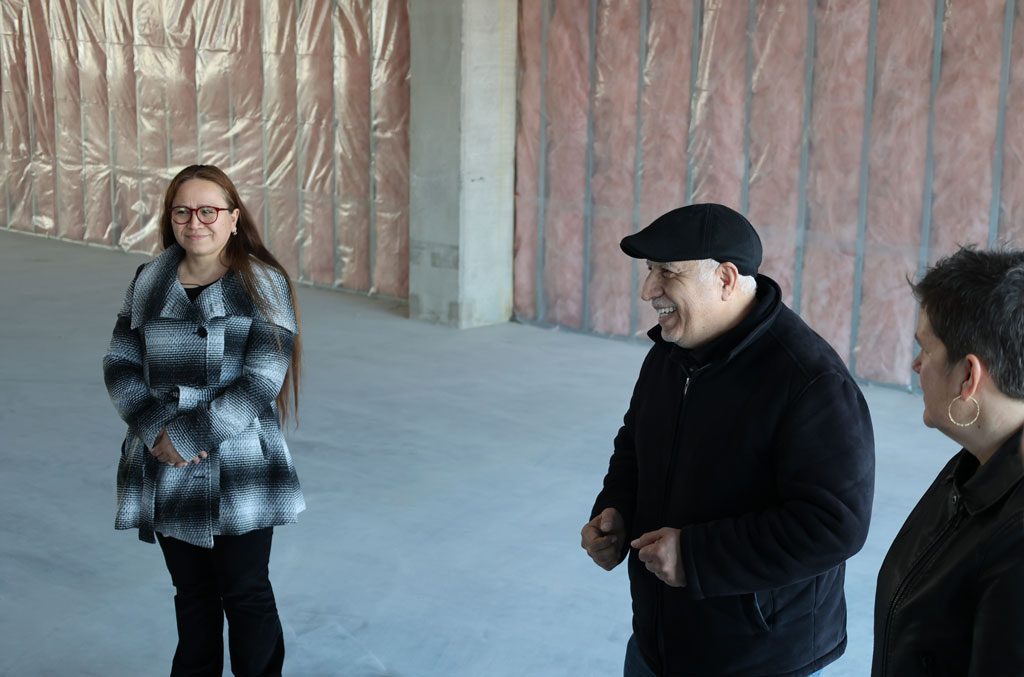 Abel Alejo and Yolanda Hernandez discuss their new commercial space with Secretary Missy Hughes.