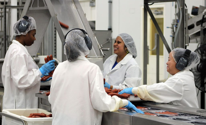Four women on a food manufacturing line.