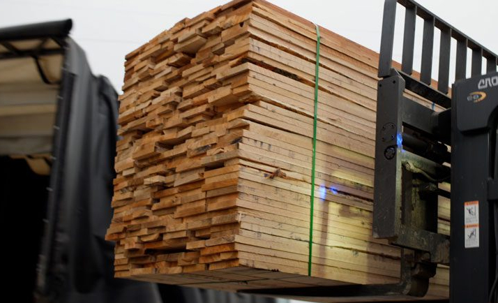 A load of lumber on a forklift