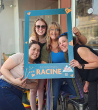 Image of four women taking a selfie in downtown Racine.