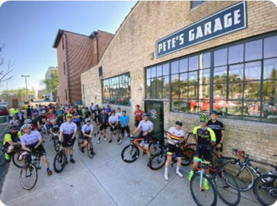 Image of group ride outside Pete’s Garage in Green Bay