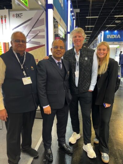 Ahlborn Equipment co-owner Woody Ahlborn and his daughter Abby meet with suppliers from India at a trade show in Germany.