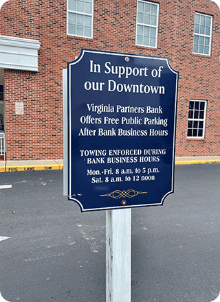 Parking sign for private business that supports free parking after business hours