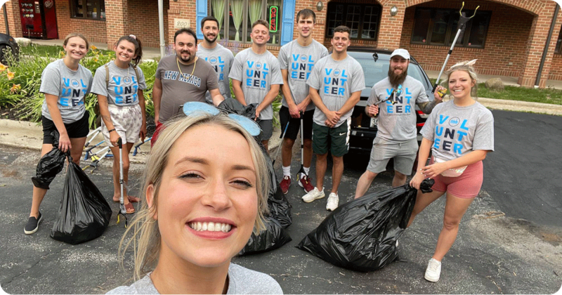 Picture of volunteers with garbage bags preparing to do a clean up project.