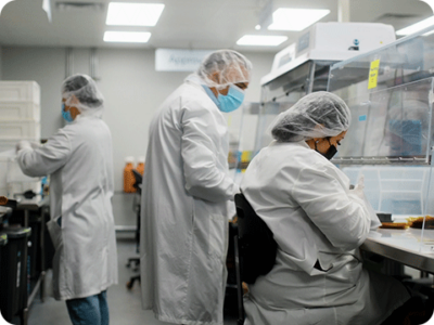 Imbed Biosciences workers in a lab