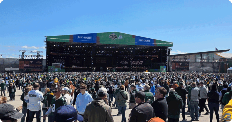 Crowd standing outside the 2025 NFL Draft stage.