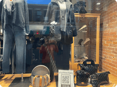QR code sign in a retail window display.