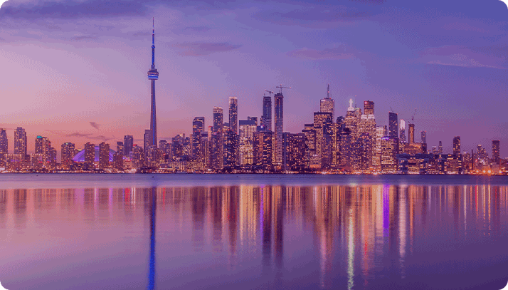 Toronto Canada city skyline reflecting off of the water.