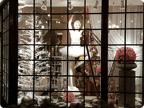 Image of a window display with a ballerina and Christmas tree