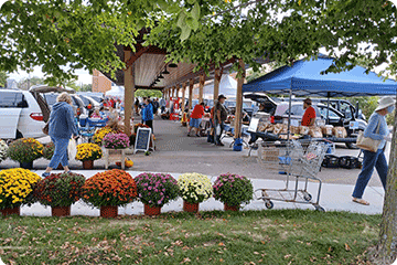 Shoppers and vendors enjoy the new Rusk County Farmers Market.