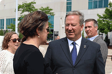 Secretary Missy Hughes speaks with Yaskawa America CEO, Mike Knapek.