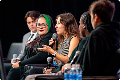 Adina Kurzban speaks to the 2025 Economic Summit audience as part of the young leaders panel.