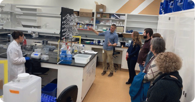 People touring a lab at Forward BIOLABS.