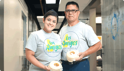 sizeup-420×240 Image shows the two owners of Los Amigos.