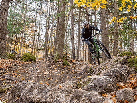 Mountain bike rider at Peninsula State Park mountain bike trails. Photo courtesy of Dan Eggert Photography.