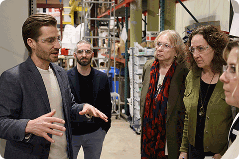 Dominick Bindl, from Realta Fusion, leads a tour for the Wisconsin Fusion Energy Coalition.
