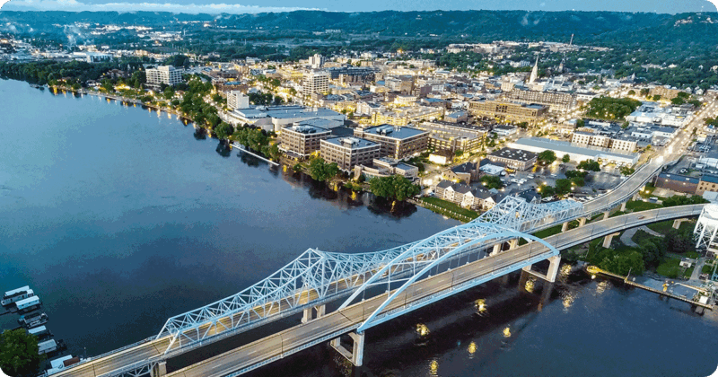 Aerial photo of downtown La Crosse, WI and a bridge over the Mississippi River.