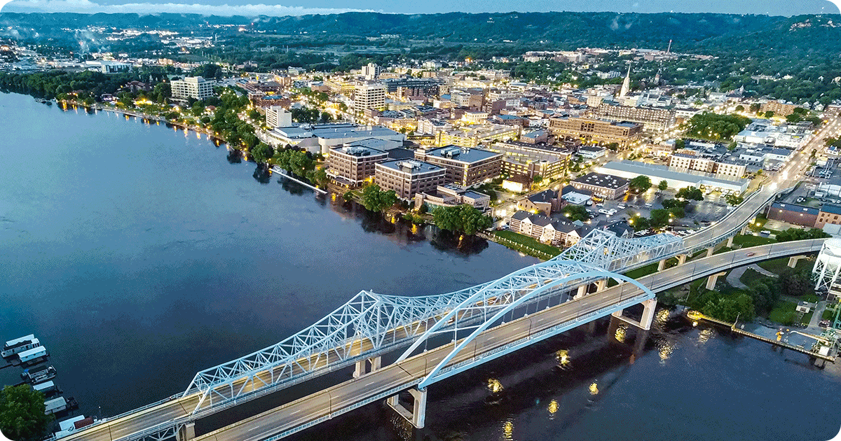 Aerial photo of downtown La Crosse, WI and a bridge over the Mississippi River.
