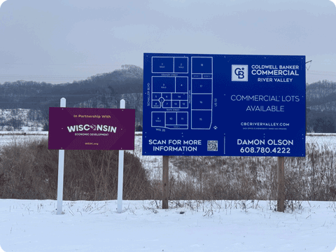 Signs indicating available commercial lots available for development. Partnership with Wisconsin Economic Development Corp.
