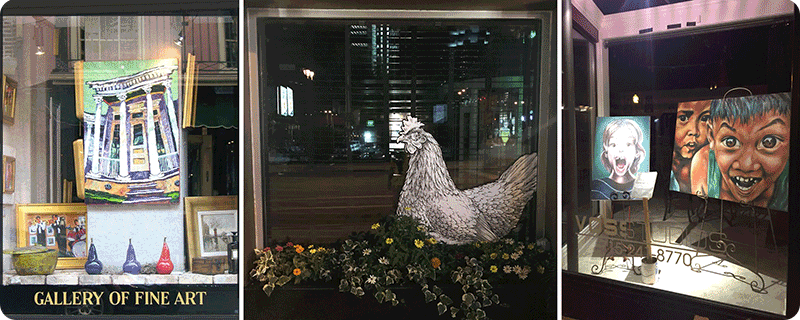 Examples of artwork displayed in a window.