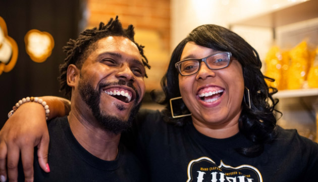 African-American couple smiling and posing for a photo