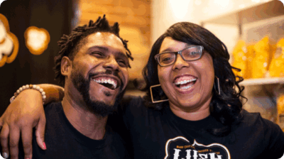 African American couple smiling.