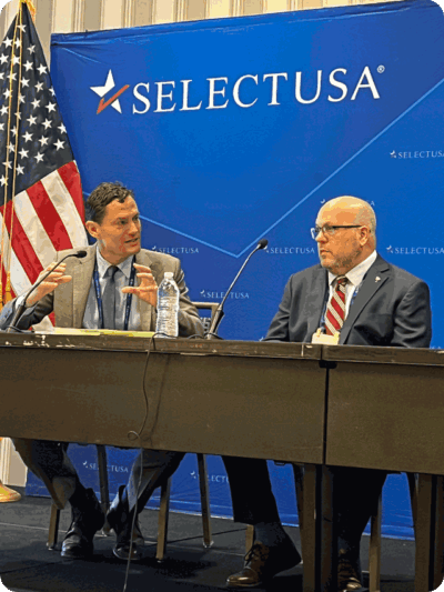 Sam Rikkers (left) participating in panel discussion at SelectUSA.