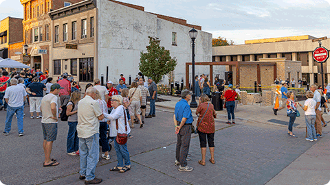 People gather at Pocket Park in Monroe.