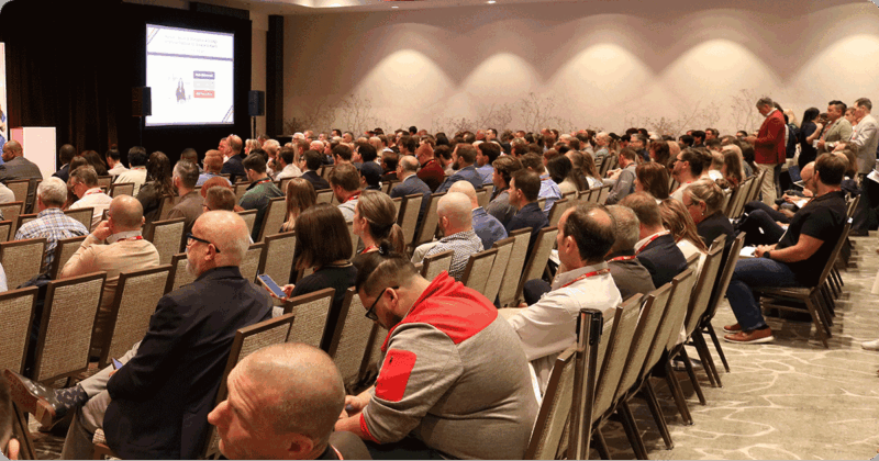 Summerfest TECH attendees listen to keynote address.