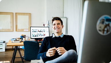 innovators-banner (1) A man sitting in a desk chair.