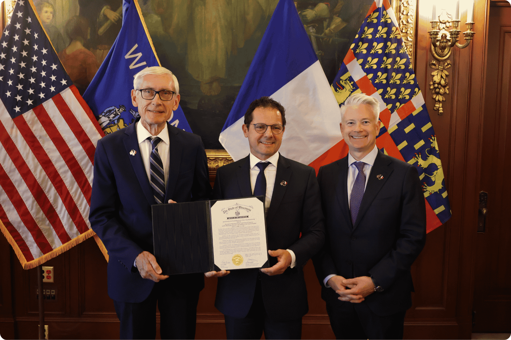 Gov. Evers and President Durain sign MOU to establish a sister-state relationship between Wisconsin and the BFC region in France. Also pictured, WEDC secretary and CEO Jon Miller.